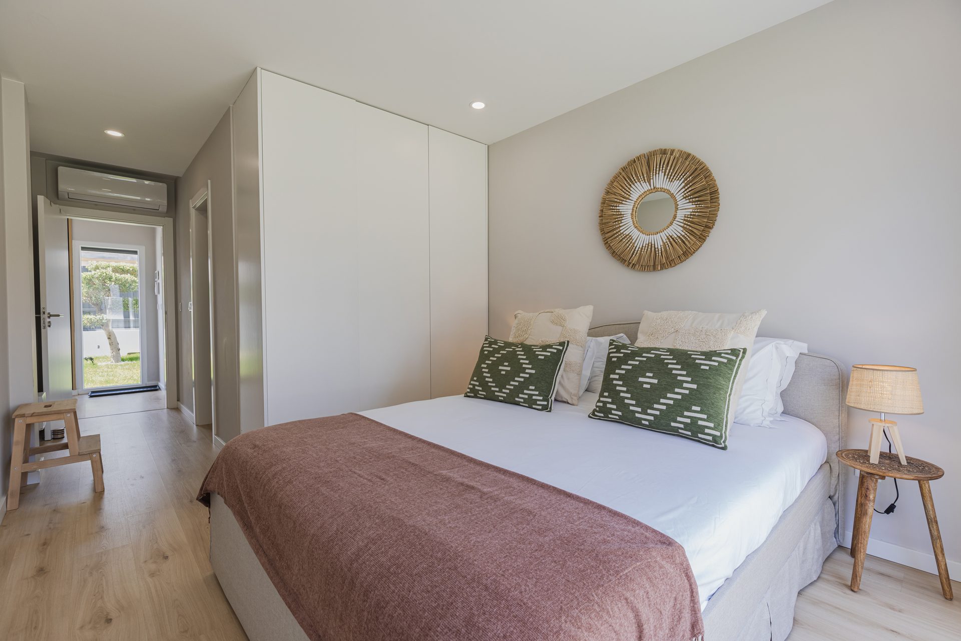 Bedroom with yellow accent pillows