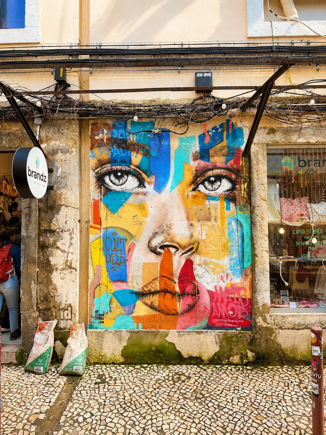 Colourful street-art mural on a Lisbon facade