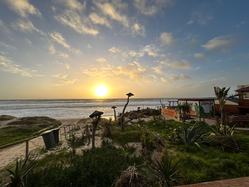 Sunrise over a surf school and the Atlantic at Fonte da Telha