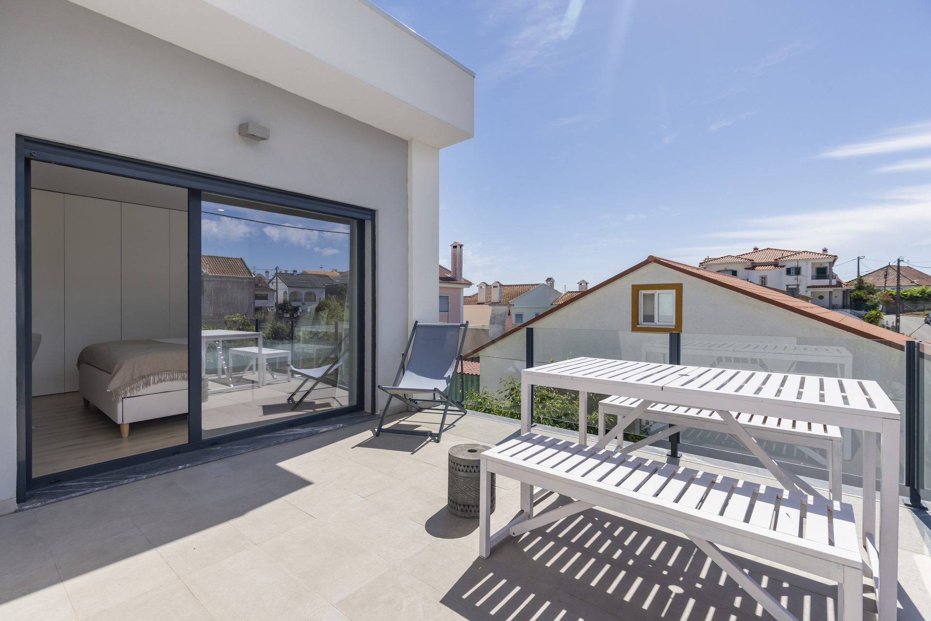Upper terrace with seating and views over neighbouring rooftops